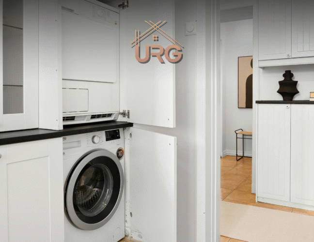 Modern laundry renovation in Coogee, Sydney with overhead storage, front-load washer, and white subway tiles