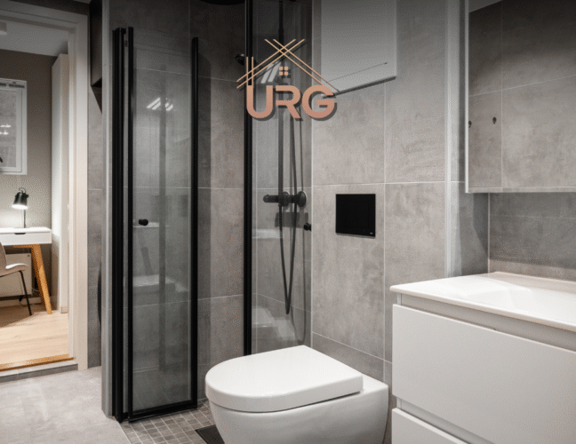 Luxury Sydney ensuite featuring marble tiles, brushed brass fixtures, and space-saving design