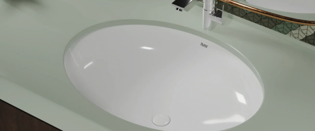 Undermount basin with stone vanity top in Sydney bathroom